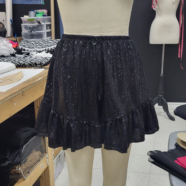 Black sequined ruffle shorts.  High elastic waistband and ruffled hem.