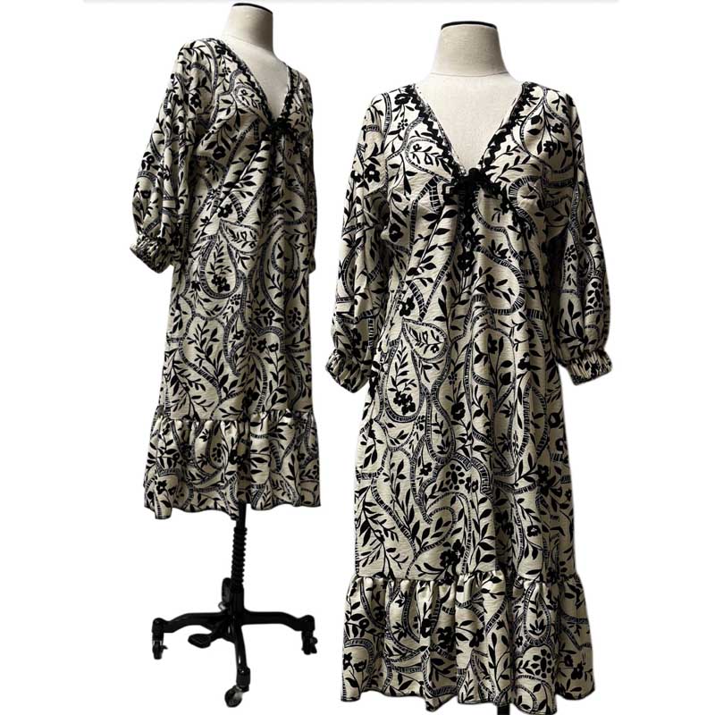 Lightweight, loose fitting rayon crepe is perfect for summer.  Empire waist with long balloon sleeves and ruffle
