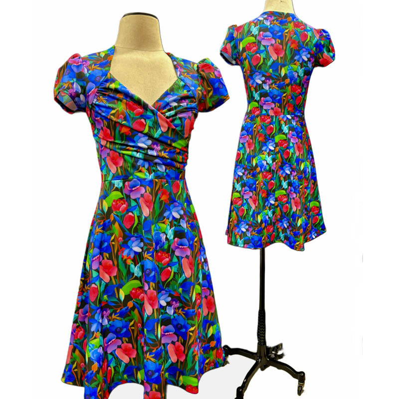Ruched wrap 1940's bodice, gathered cap sleeves, A-line skirt. She’s a cutie! 