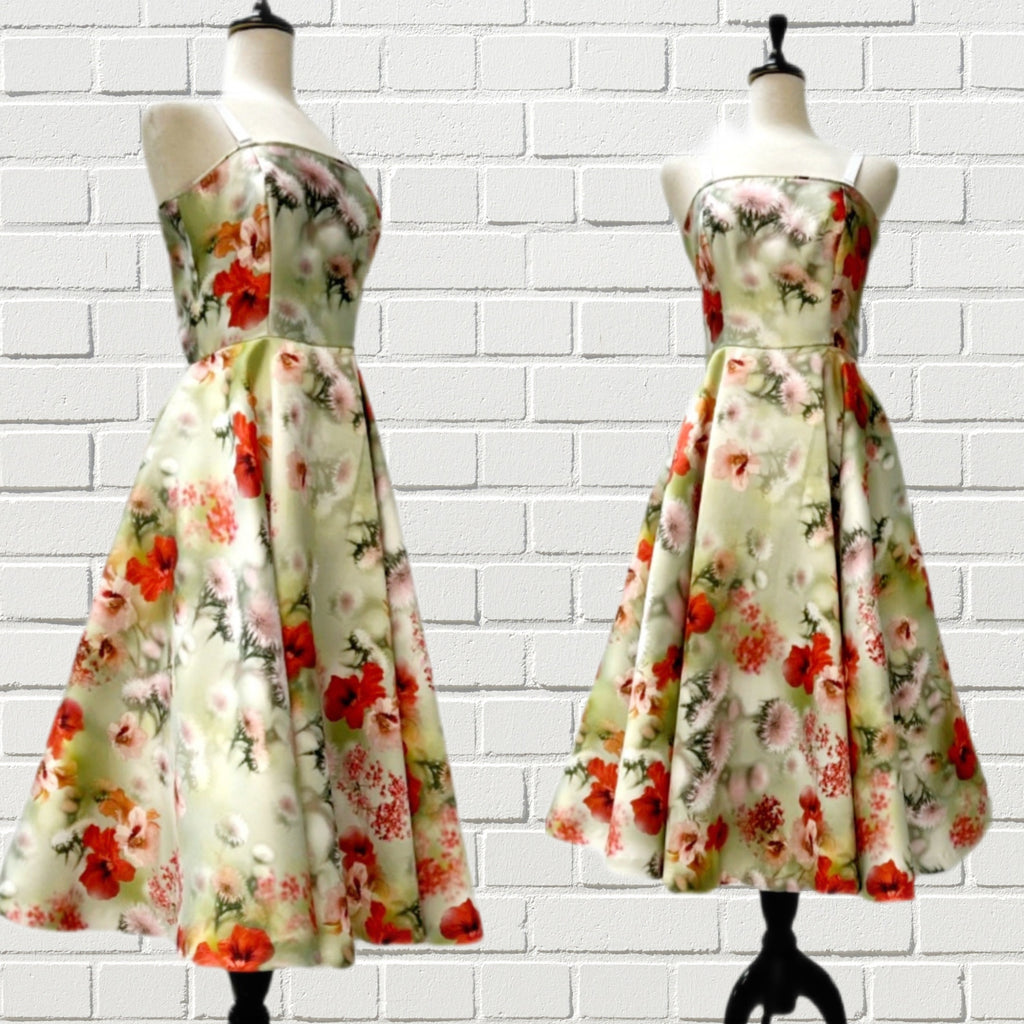 Mannequin form showing the Laura Cocktail dress in a thistle flower print digital satin. Fitted bodice with detachable slip straps, full tea length circle skirt with side seam pockets, back zipper closure.
