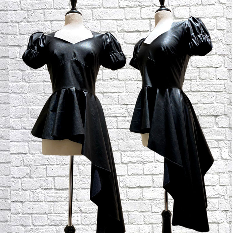 Faux leather peplum top with sweetheart neckline, puff sleeves, and an exaggerated asymmetrical ruffle hem