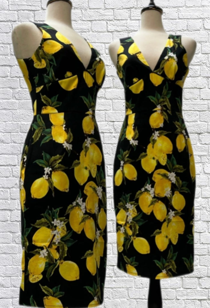 Mannequin form shows the Audrey Pencil Dress in a Lemon print cotton sateen. Deep V-neck and back, sleeveless, back zip closure, fitted skirt with back centre seam vent, full lining.