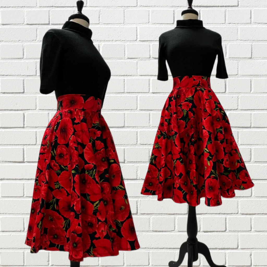 Mannequin forms showing the Audrey Skirt in vibrant red on navy blue poppy print with a high waistband, circle skirt, side seam pockets, and full lining.