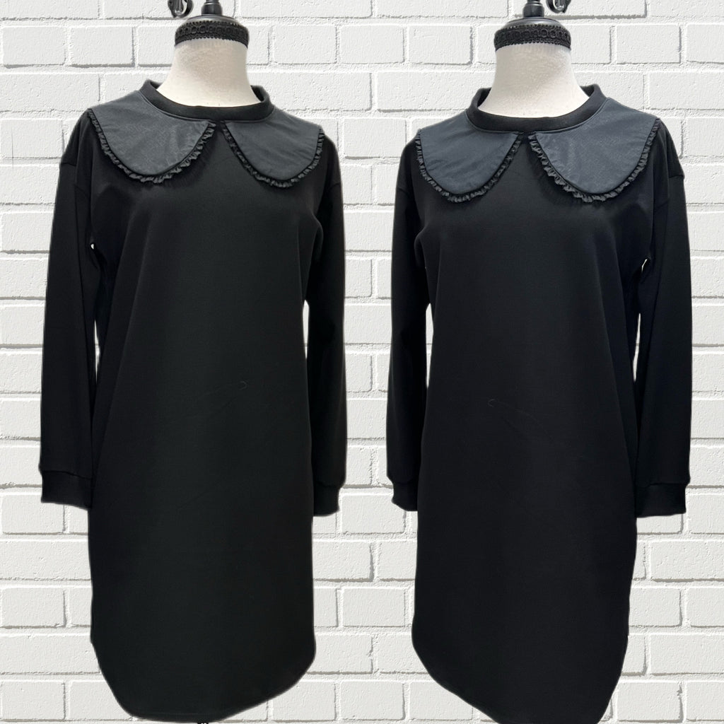 Mannequin forms showing the Bella Tunic black double knit Ponte with bamboo ribbed knit cuffs and a black linen collar.