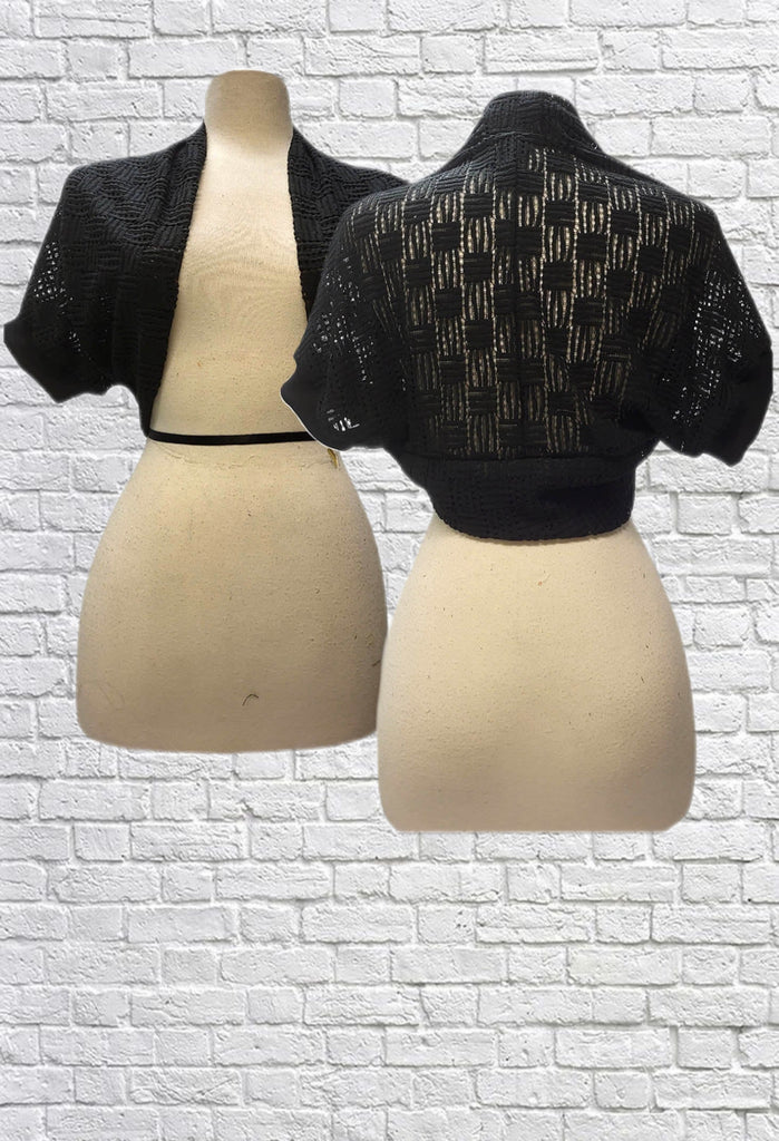 Open weave bolero shrug with short sleeves in black.