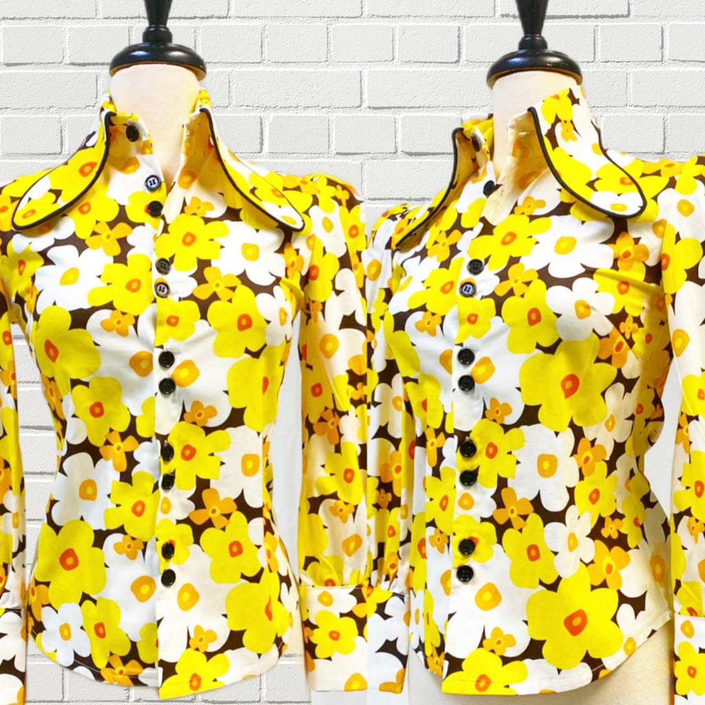 Mannequin bust showing the Ivy Blouse in Pop Art Flower features an exaggerated collar, extra large cuffs, and bishop sleeves.