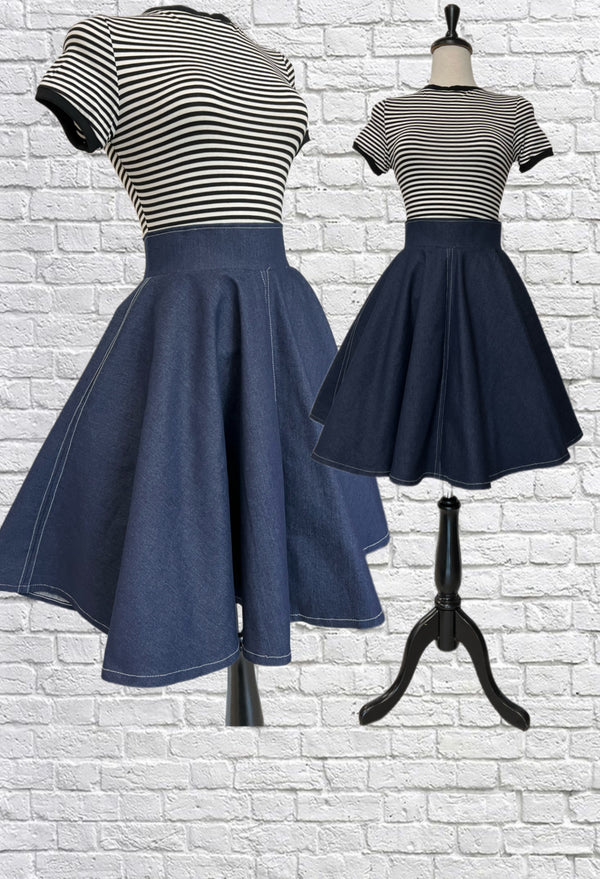 Mannequin forms showing the side and front profile of the Laura Skirt in Organic Cotton Denim with side seam pockets, full lining, high waistband, centre back zipper closure, and contrast top stitching.