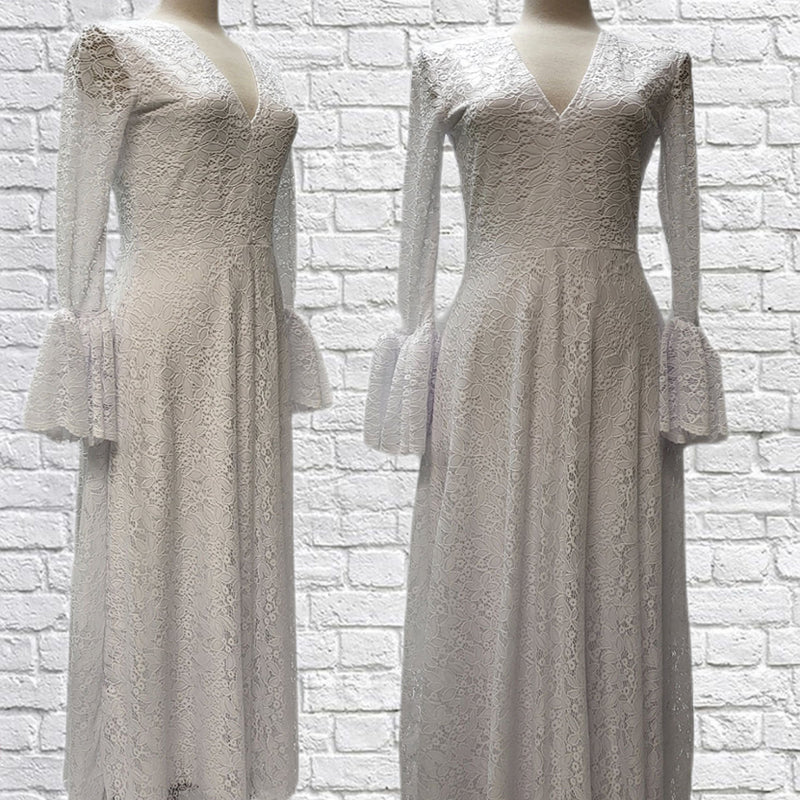 Mannequin forms showing the side and front profile of the Randi dress in white stretch lace over gorgeous white bamboo knit. Fitted bodice, V-Neck, A-line maxi skirt, long, bell sleeves with scalloped hem.