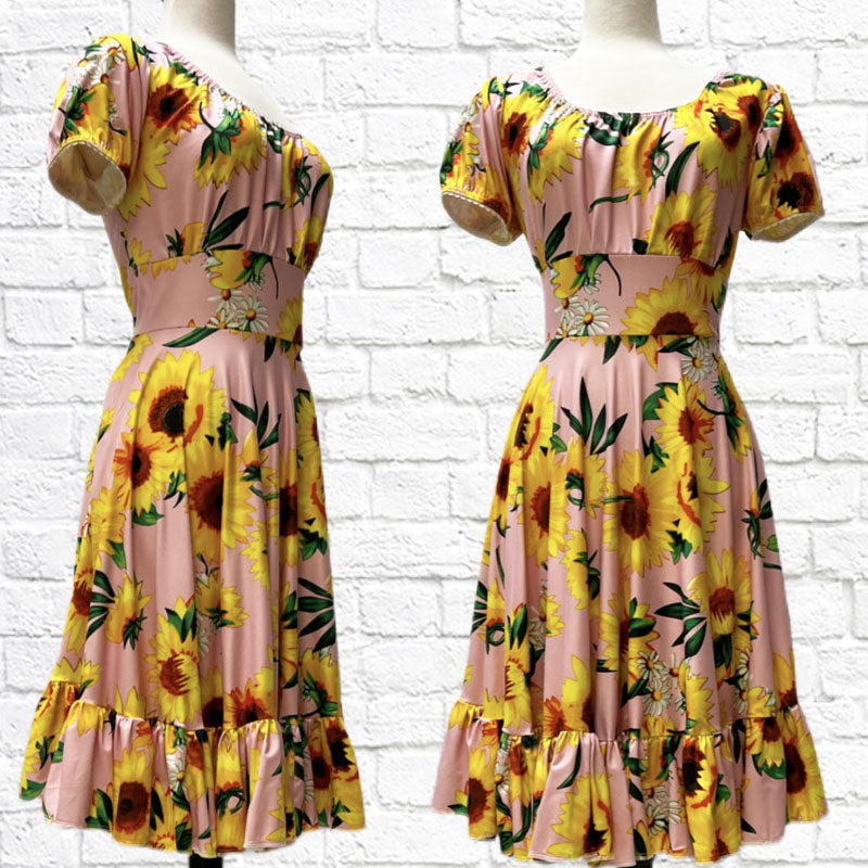 Mandy Dress in a sunflowers print bamboo knit featuring an empire waist, circle skirt, peasant style top, and short puffed sleeves.