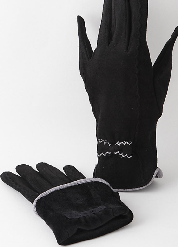 Stay warm this winter in style with our ultra suede gloves with scalloped embroidered detail, contrast trim. Available at Blackbird Studios Canada.