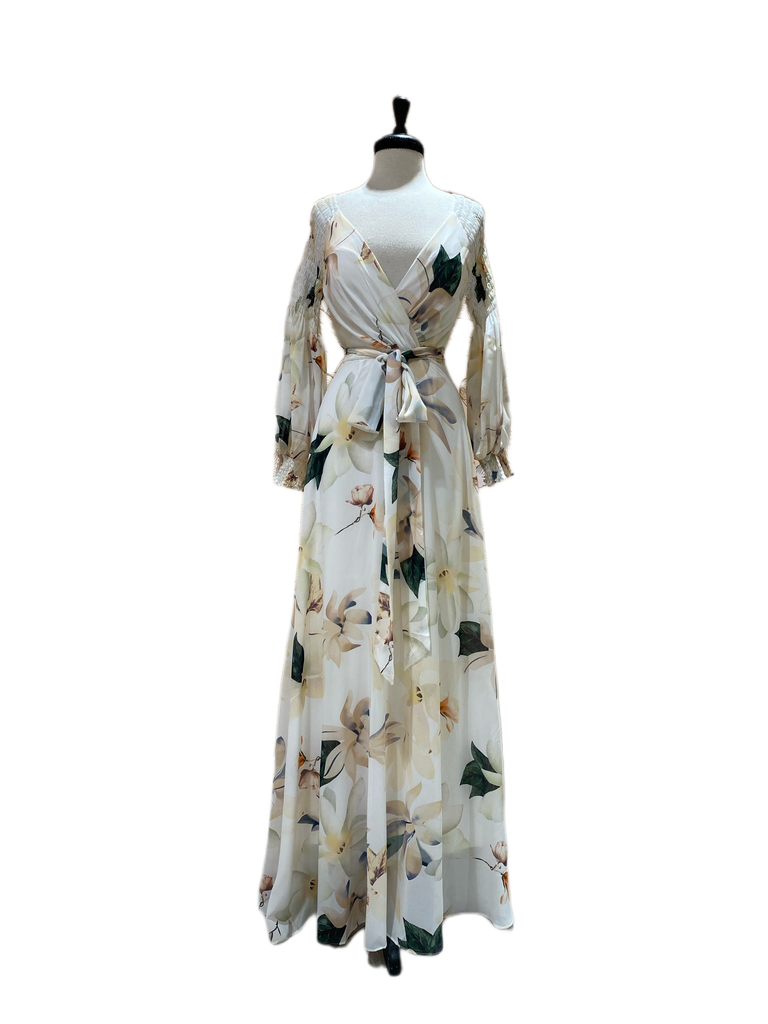 Eden Gown in floral print ivory chiffon has a crossover front, smocked Juliet sleeves with smocked cuffs, waist tie belt, back zipper closure, floor length skirt and is fully lined with a padded bust.