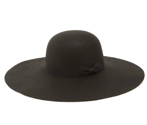 A black wide brim hat with a small subtle bow around the base of the hat sits against a white backdrop.
