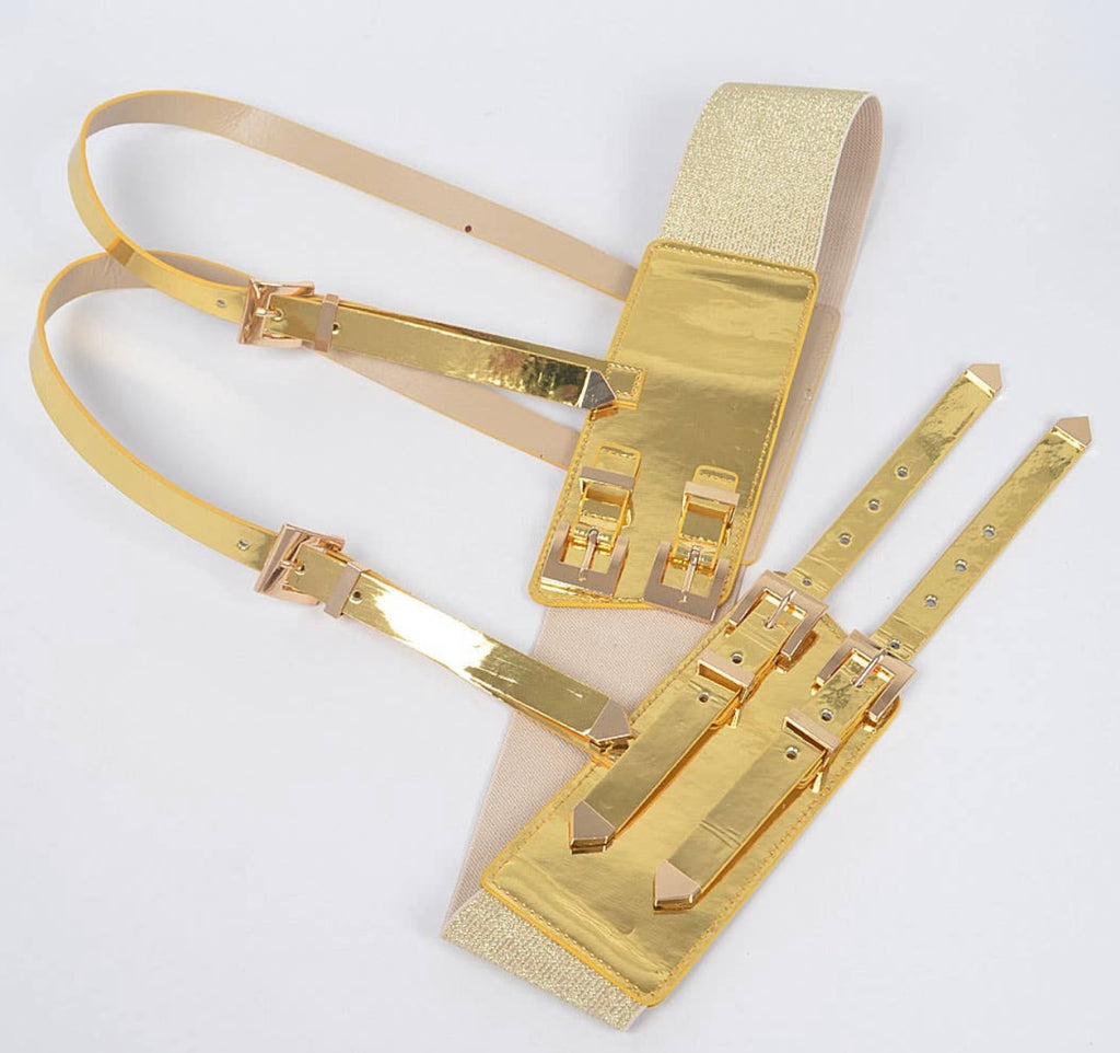 Gold fashion harness belt against a white background.